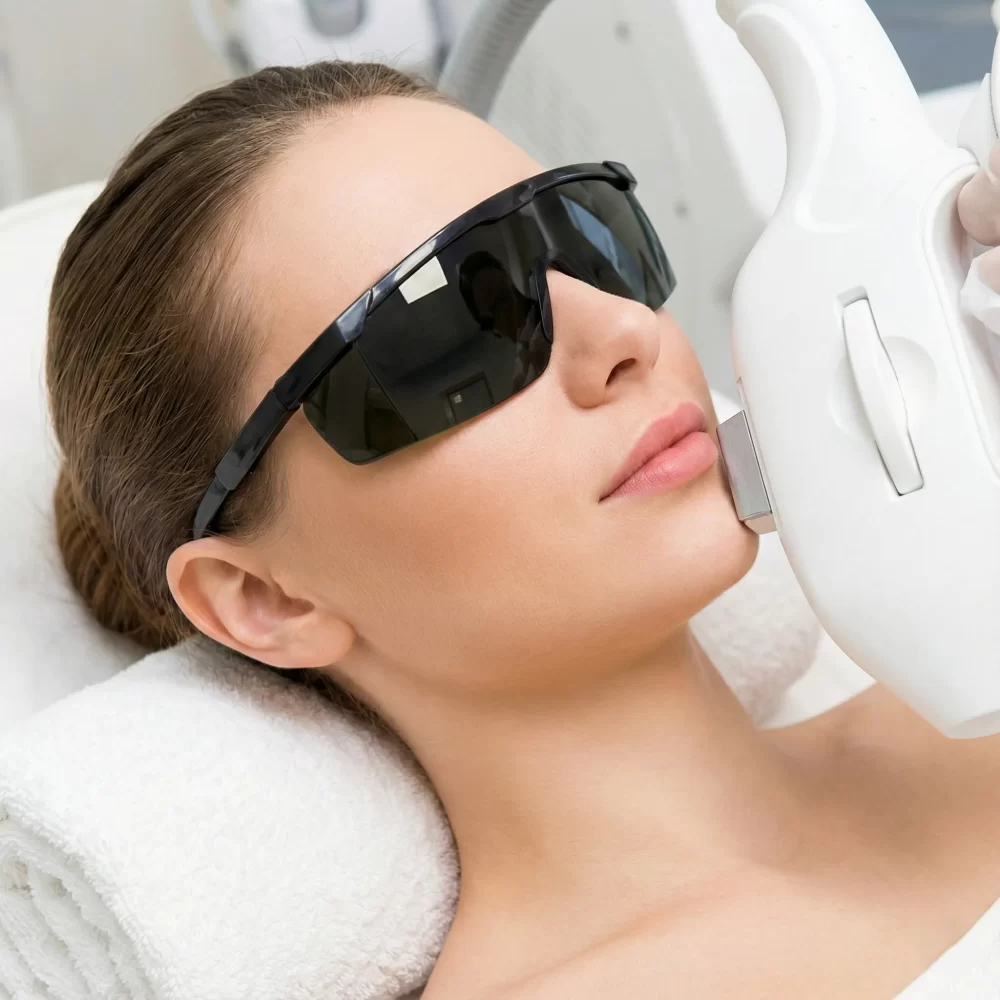 A client undergoing GlowMedi OPT Light Targeted Facial Therapy